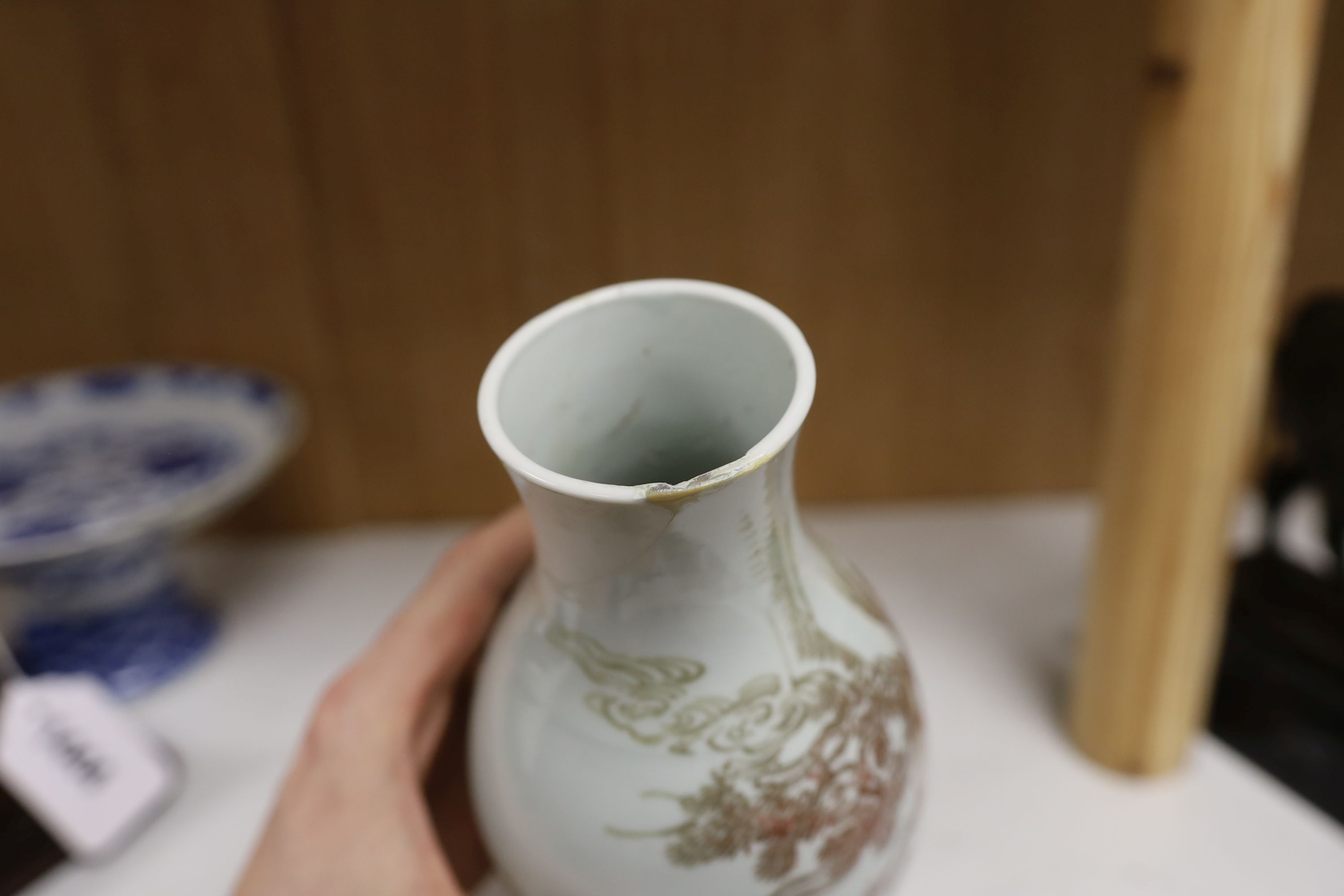 A Chinese underglaze copper red ‘herder and goats’ vase, Kangxi six character mark but Republic period and a Chinese blue and white lotus stem dish, six character Guangxu mark and period, both damaged